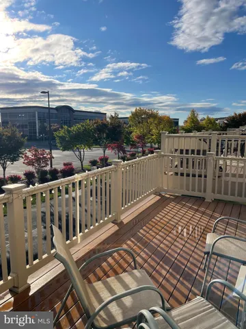 a view of balcony with wooden floor