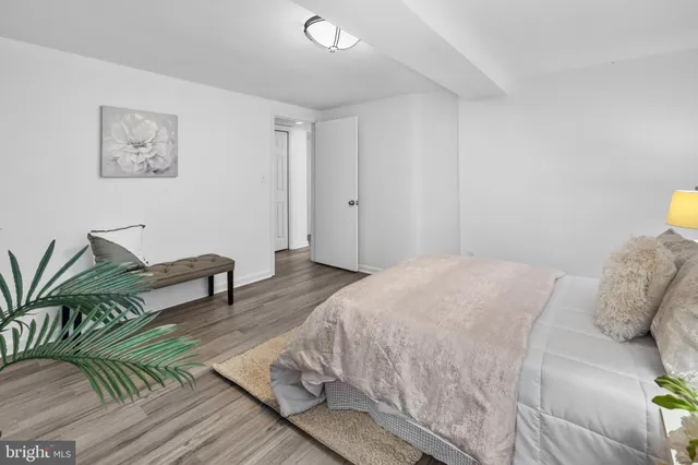 a bedroom with a bed and a couch