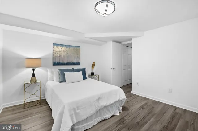 a bedroom with a bed and a lamp