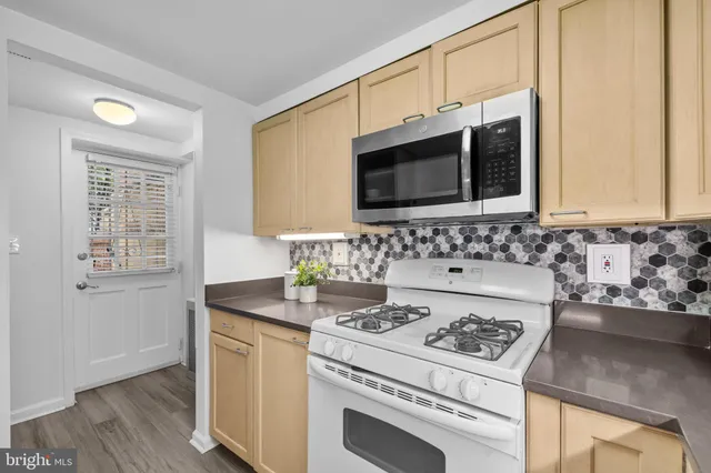 a kitchen with a stove and a microwave