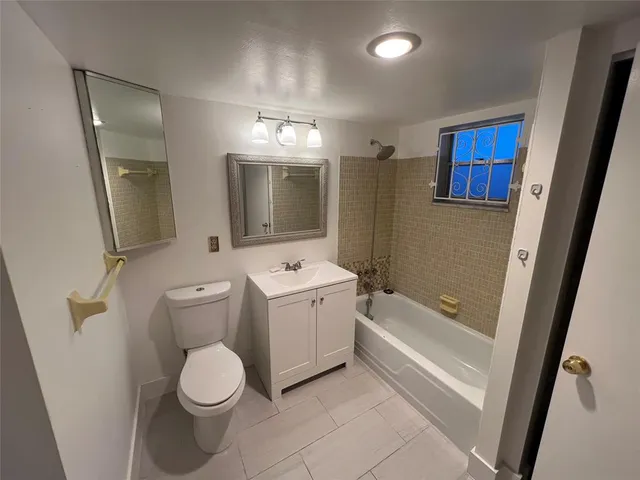 a bathroom with a toilet sink and mirror or bathtub