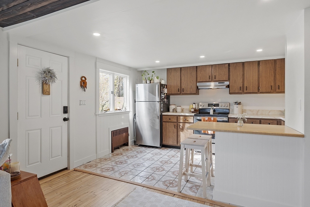 2 Summit Terrace Peabody, MA 01960 - Photo 15 of 39 a kitchen with stainless steel appliances granite countertop a refrigerator and a stove top oven
