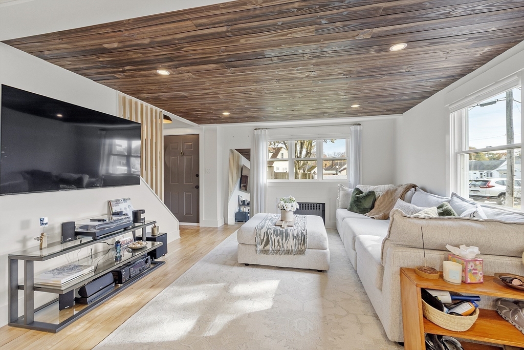 2 Summit Terrace Peabody, MA 01960 - Photo 7 of 39 a living room with furniture and a flat screen tv