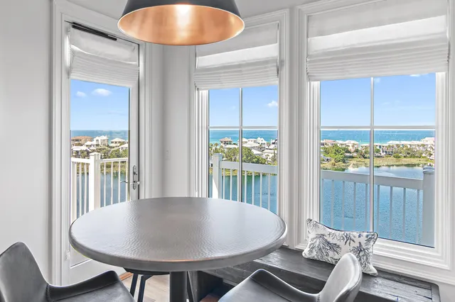 a kitchen with kitchen island granite countertop a sink a counter space appliances and cabinets