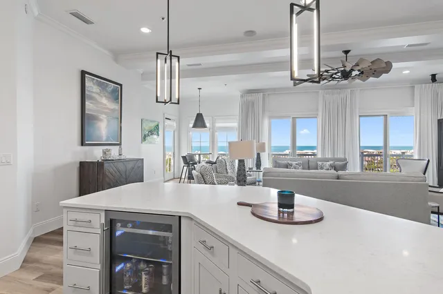 a kitchen with stainless steel appliances a refrigerator sink and cabinets