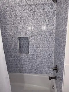 an aerial view of a house with a lake view