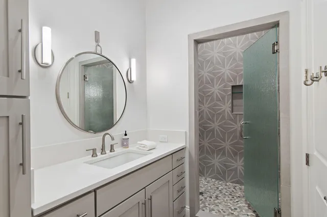 a bathroom with a sink and a mirror