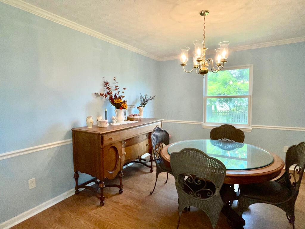 5294 Bressler Drive Hilliard, OH 43026 - Photo 6 of 45 Spacious dining room with chandelier and chair rail.