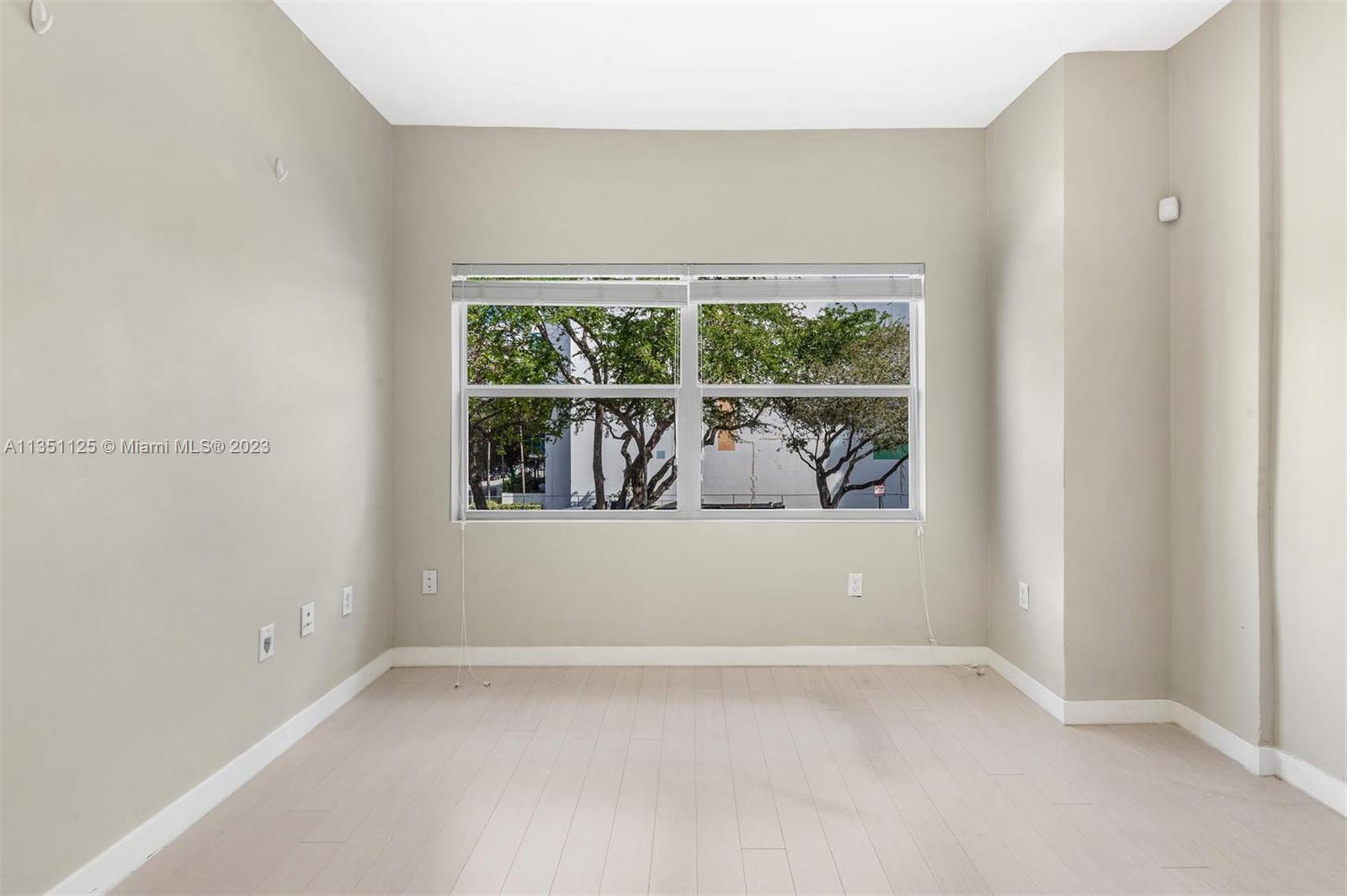 2423 Biscayne Boulevard, Unit 2 Miami, FL 33137 - Photo 12 of 14 a view of an empty room with a window