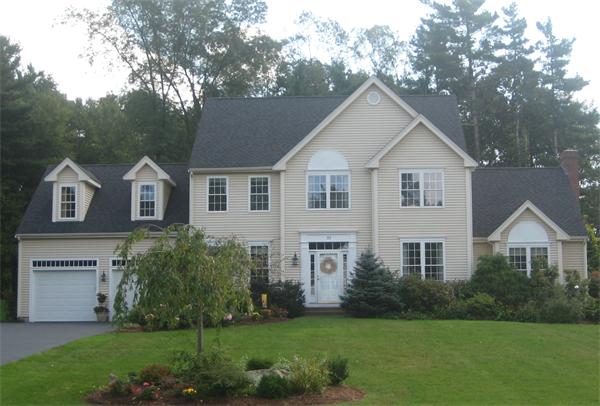 33 Pennock Road Ashland, MA 01721 - Photo 1 of 14 a front view of a house with a yard and garage