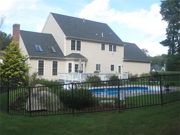 33 Pennock Road Ashland, MA 01721 - Photo 13 of 14 a front view of a house with a garden