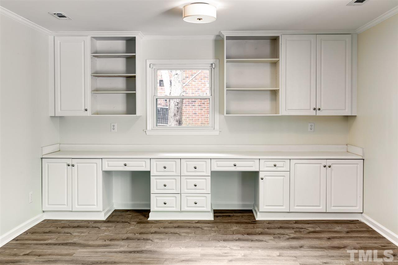6820 Rainwater Road Raleigh, NC 27615 - Photo 12 of 22 a view of cabinets with wooden floor