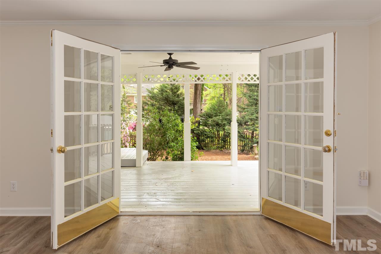 6820 Rainwater Road Raleigh, NC 27615 - Photo 15 of 22 a view of an empty room with wooden floor and a window