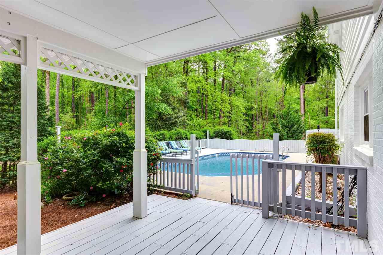 6820 Rainwater Road Raleigh, NC 27615 - Photo 2 of 22 a view of a wooden deck next to a yard