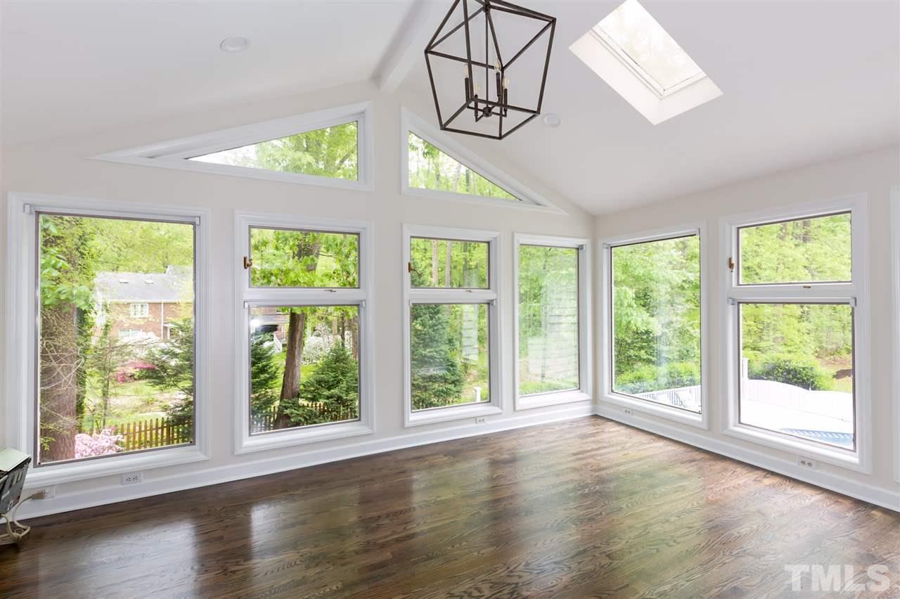 6820 Rainwater Road Raleigh, NC 27615 - Photo 22 of 22 a view of an entryway with wooden floor and windows