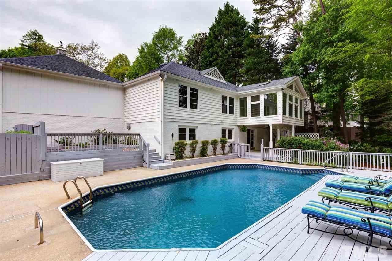 6820 Rainwater Road Raleigh, NC 27615 - Photo 3 of 22 a view of a house with pool fire pit a patio and a yard