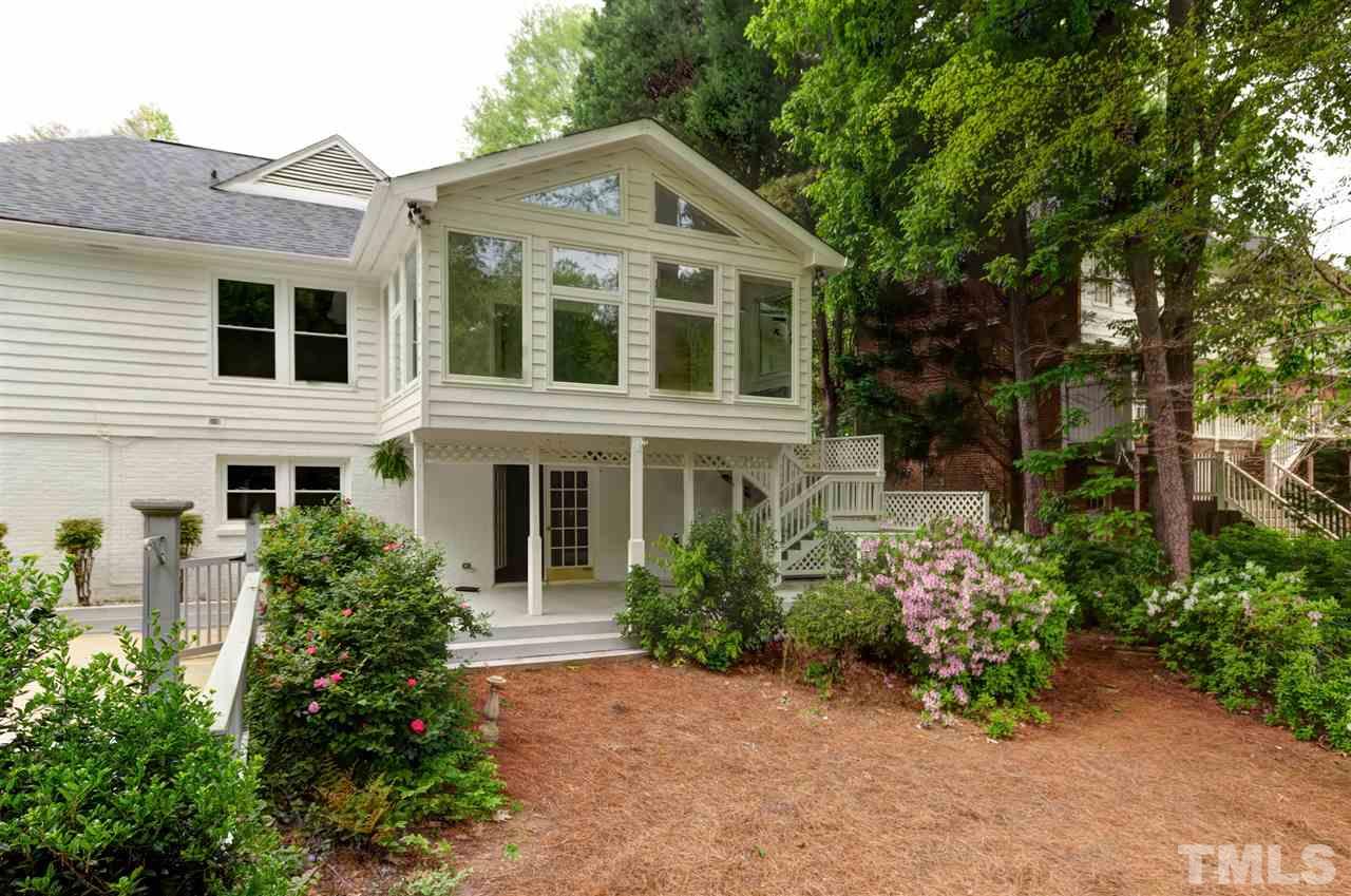 6820 Rainwater Road Raleigh, NC 27615 - Photo 6 of 22 a front view of a house with a garden