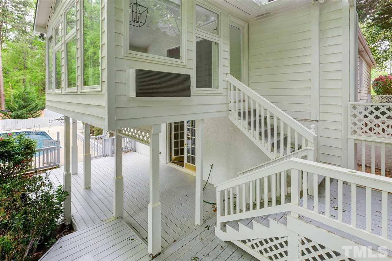 6820 Rainwater Road Raleigh, NC 27615 - Photo 7 of 22 a view of balcony with wooden floor and fence