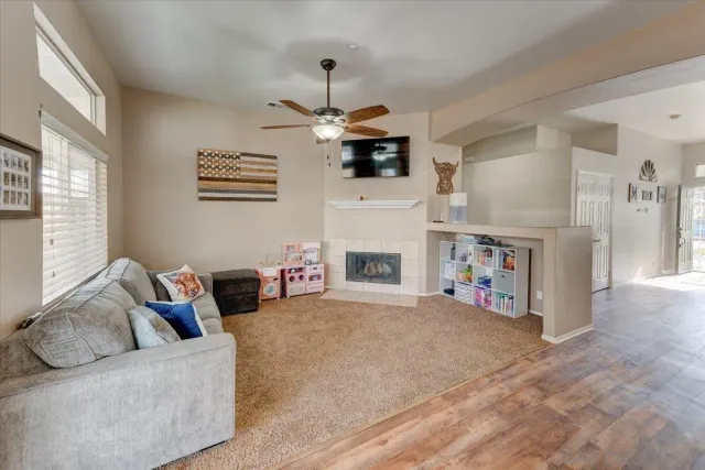 a living room with furniture and a fireplace