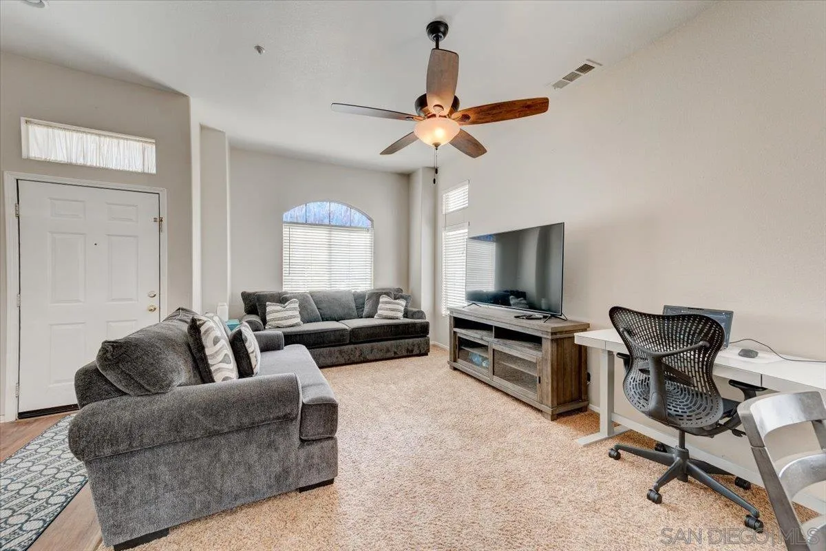 1359 H Street Ramona, CA 92065 - Photo 16 of 52 a living room with furniture a flat screen tv and a window