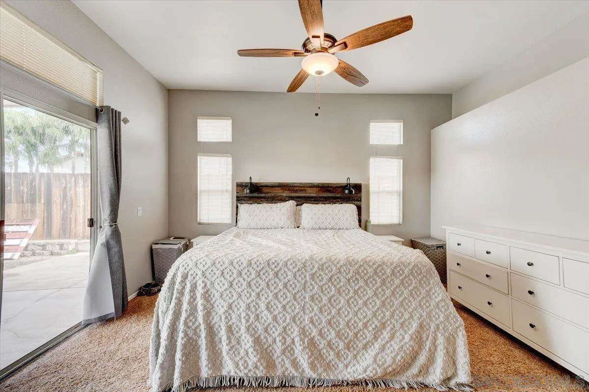 1359 H Street Ramona, CA 92065 - Photo 23 of 52 a bedroom with a bed and a window