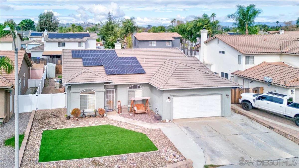 1359 H Street Ramona, CA 92065 - Photo 39 of 52 a view of a white house in front of a yard