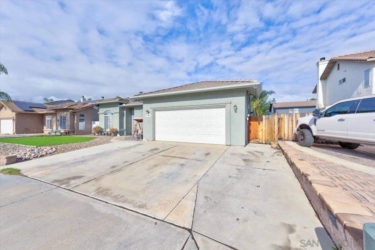 1359 H Street Ramona, CA 92065 - Photo 7 of 52 a front view of a house with a yard