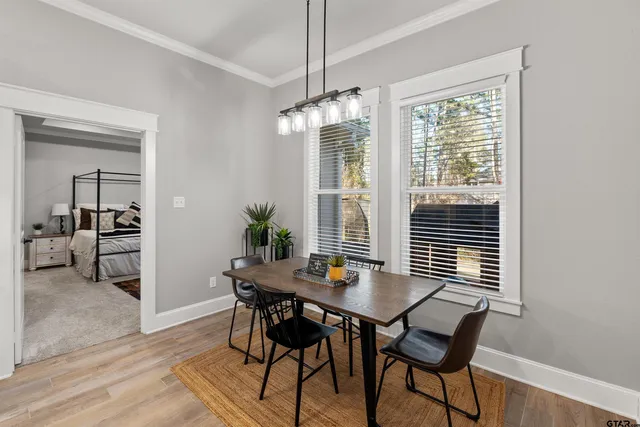 a view of a dining room with furniture and window
