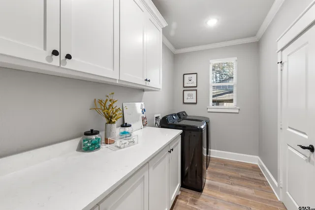 a kitchen with sink and cabinets