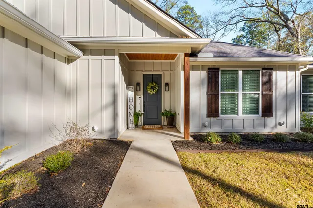 a front view of a house with a large window
