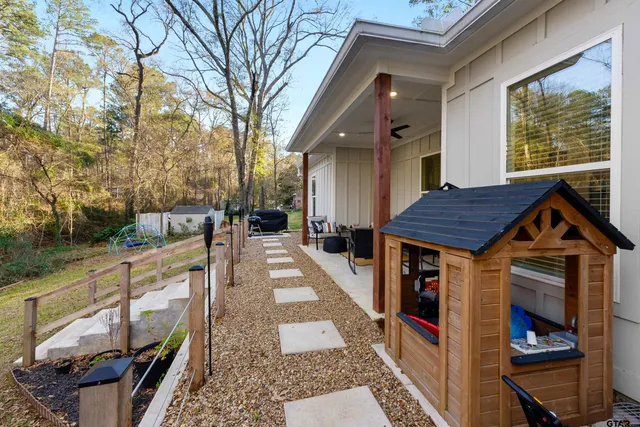 a view of a house with a outdoor patio