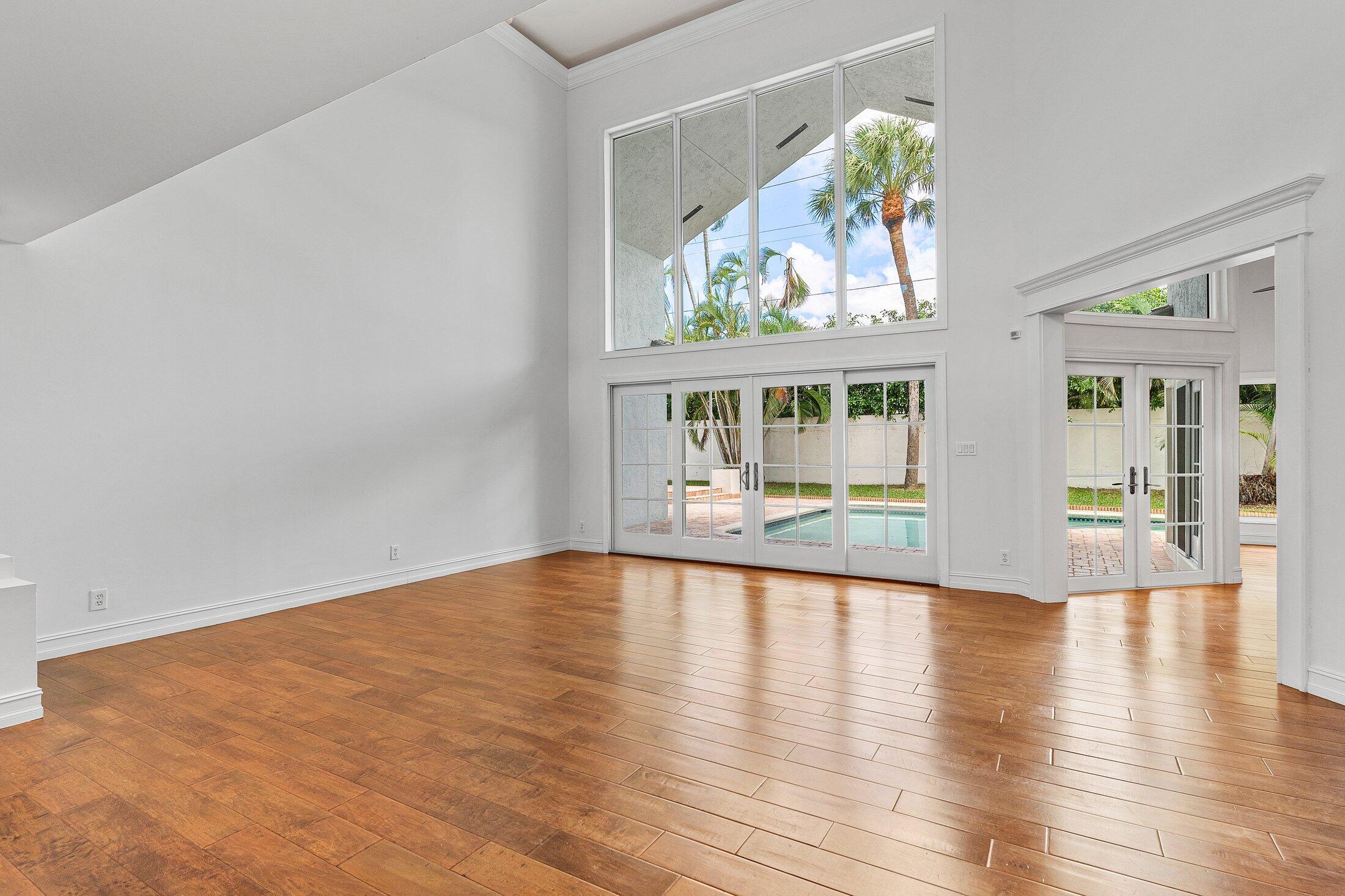 2599 Northwest 49th Street Boca Raton, FL 33434 - Photo 11 of 40 a view of an entryway with wooden floor