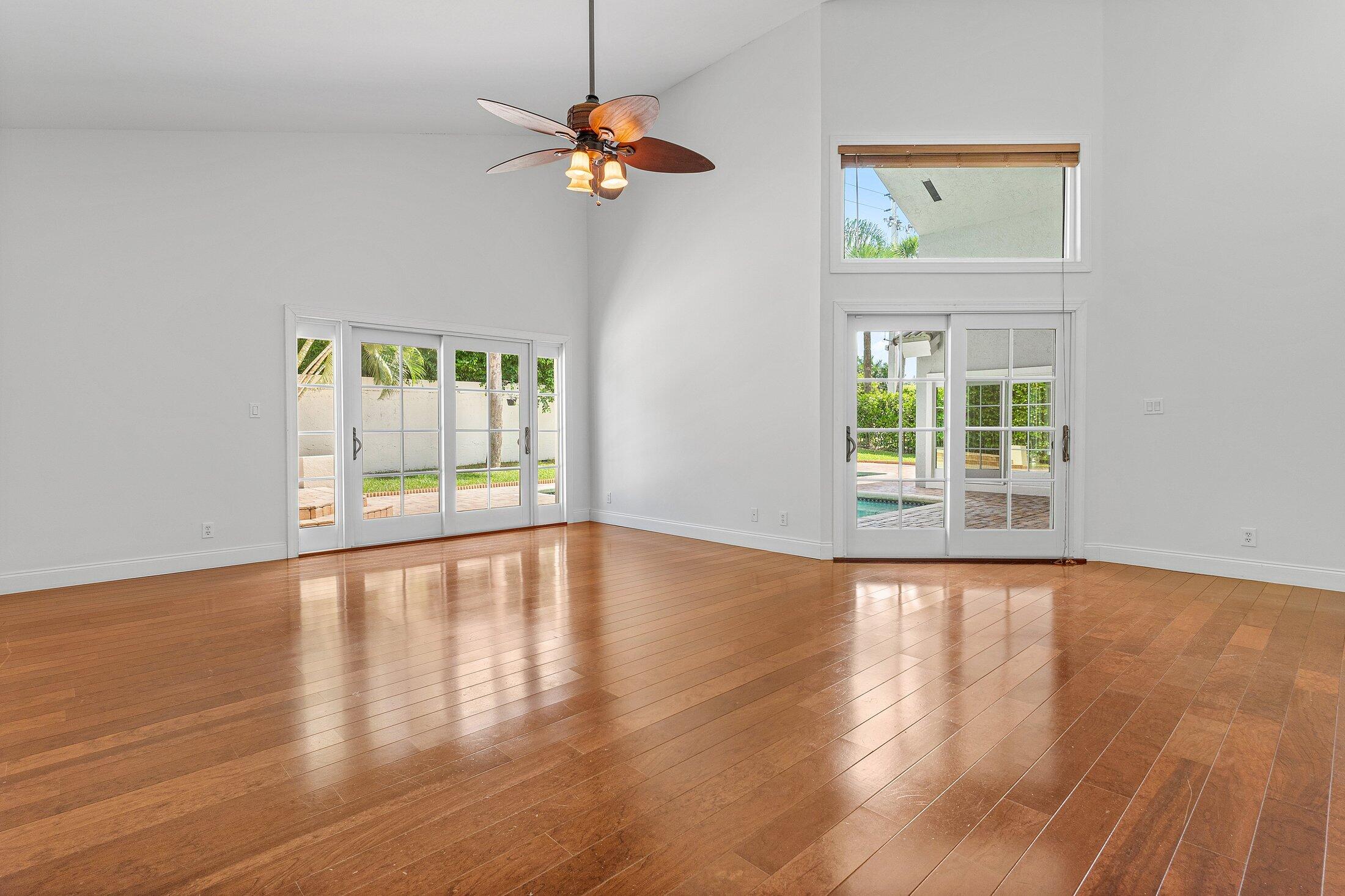 2599 Northwest 49th Street Boca Raton, FL 33434 - Photo 24 of 40 a view of an empty room with a window and wooden floor