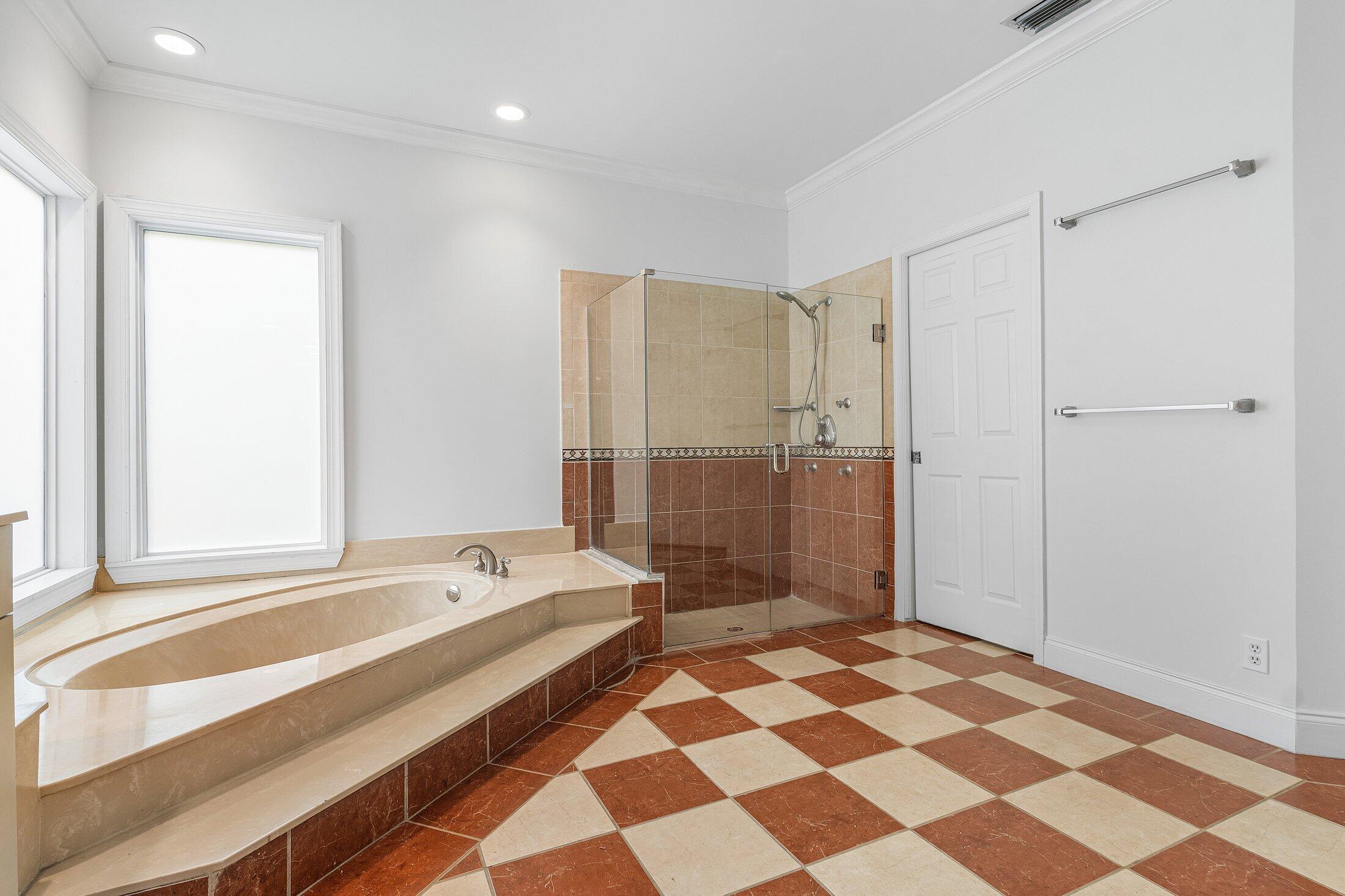 2599 Northwest 49th Street Boca Raton, FL 33434 - Photo 28 of 40 a bathroom with a bathtub and a shower