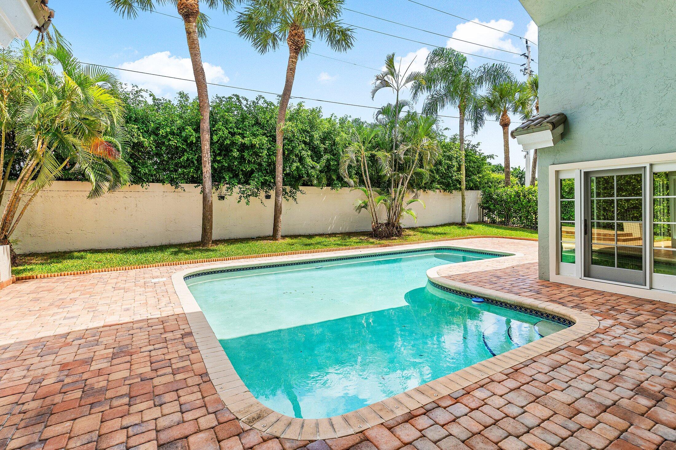 2599 Northwest 49th Street Boca Raton, FL 33434 - Photo 37 of 40 a view of a swimming pool with an outdoor seating
