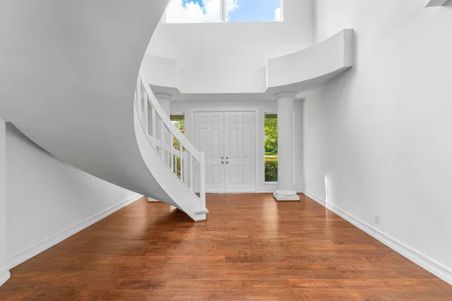 a view of an entryway with wooden floor