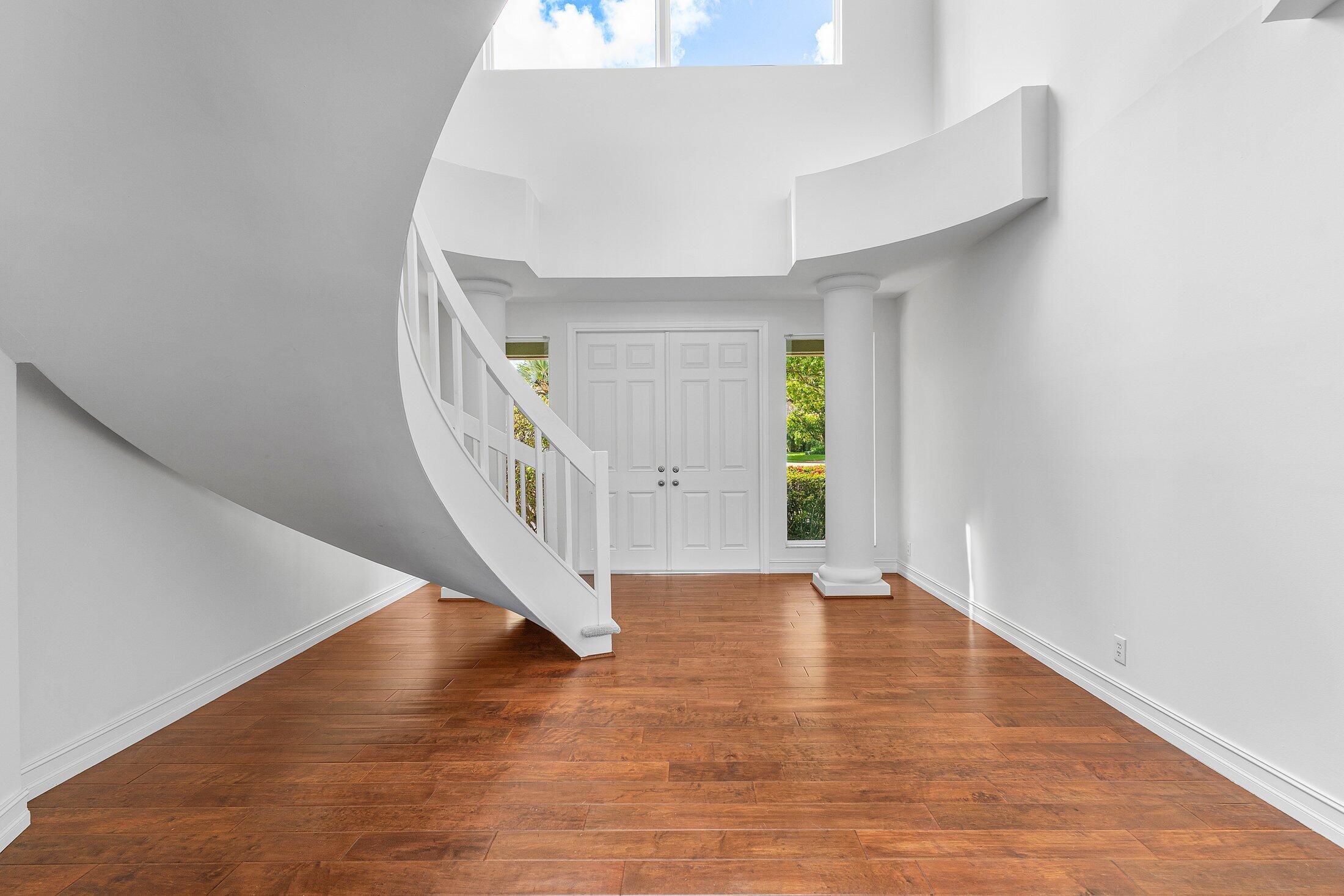 2599 Northwest 49th Street Boca Raton, FL 33434 - Photo 5 of 40 a view of an entryway with wooden floor
