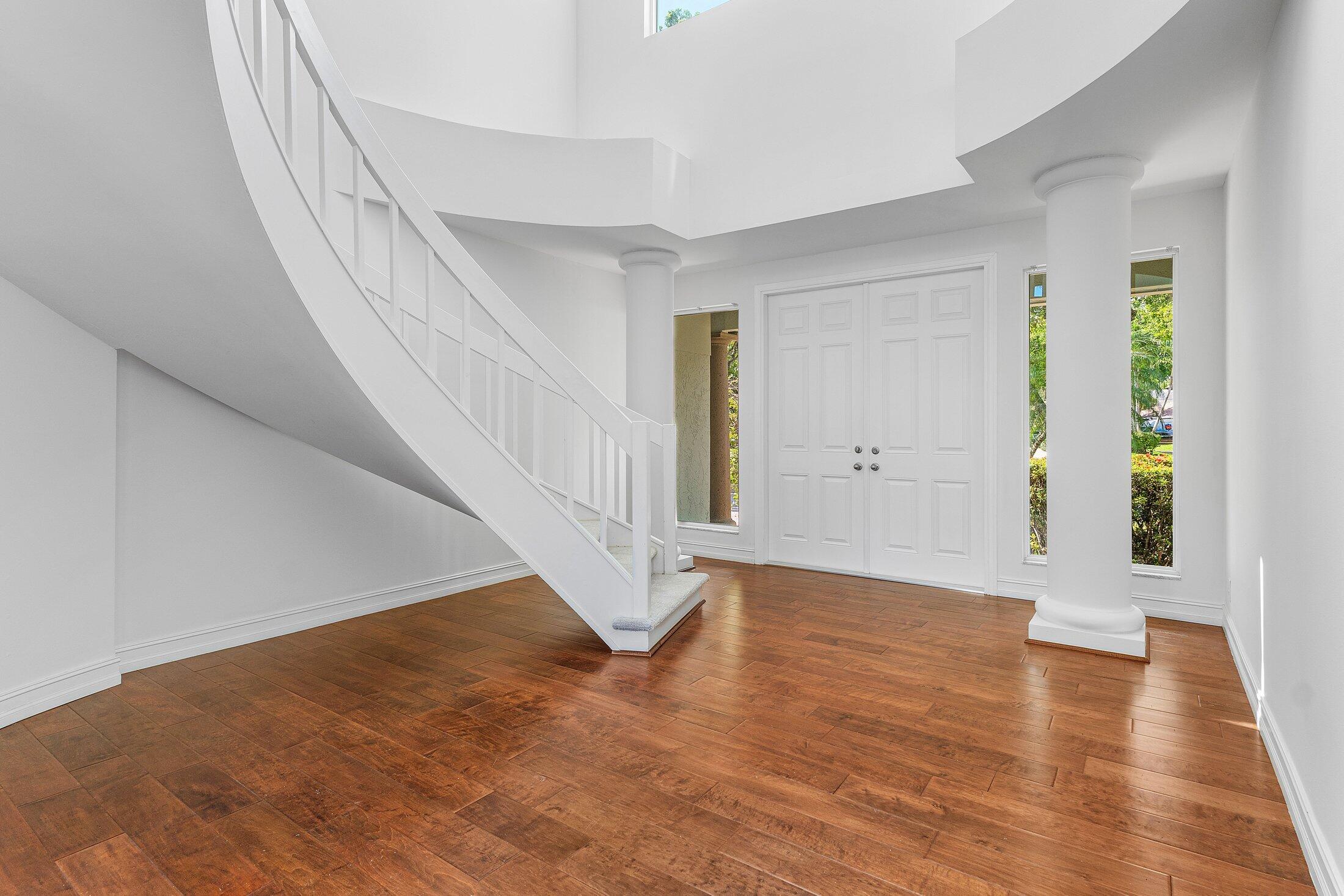 2599 Northwest 49th Street Boca Raton, FL 33434 - Photo 6 of 40 a view of an entryway with wooden floor
