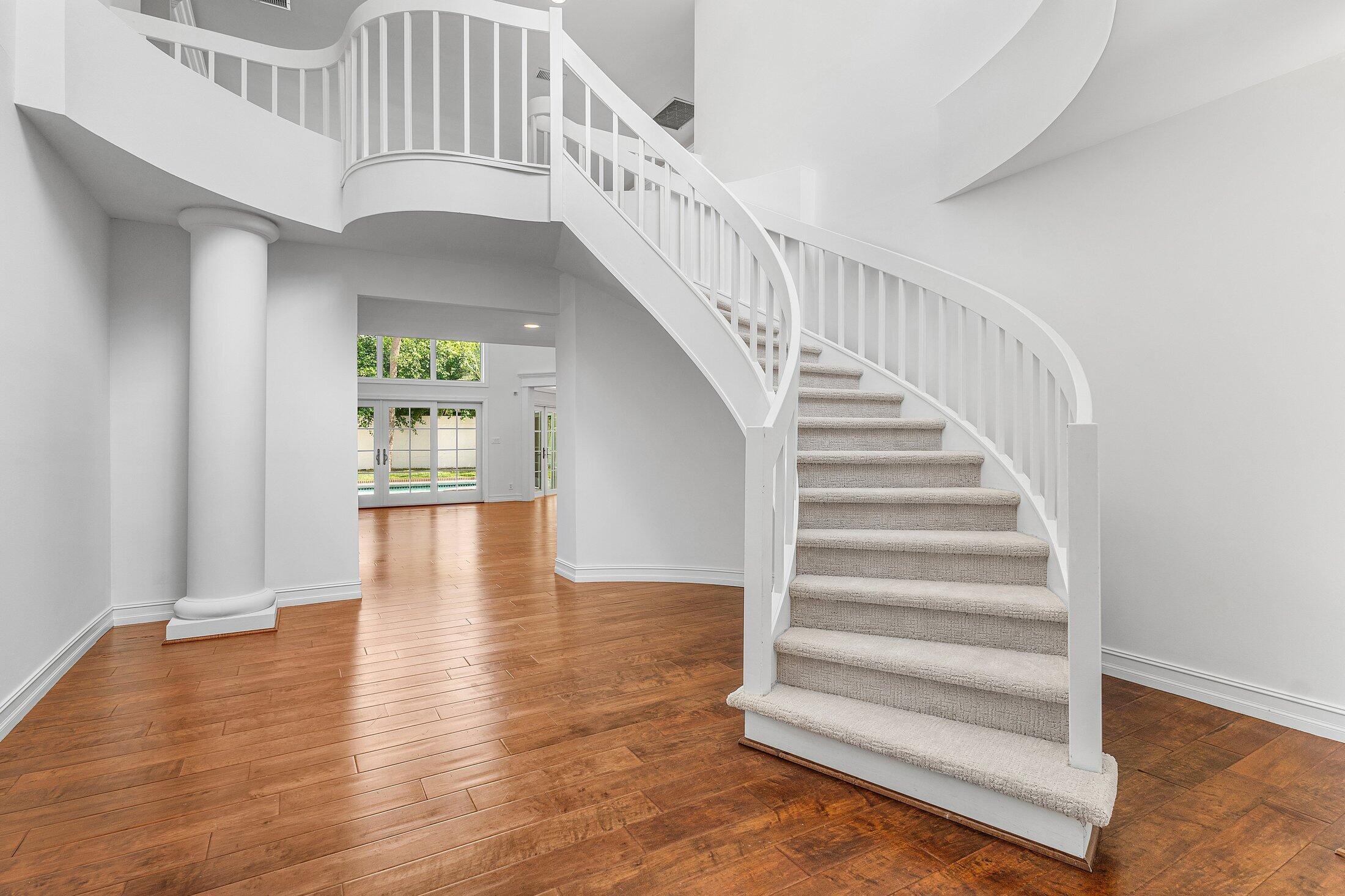 2599 Northwest 49th Street Boca Raton, FL 33434 - Photo 7 of 40 a view of entryway and hall with wooden floor