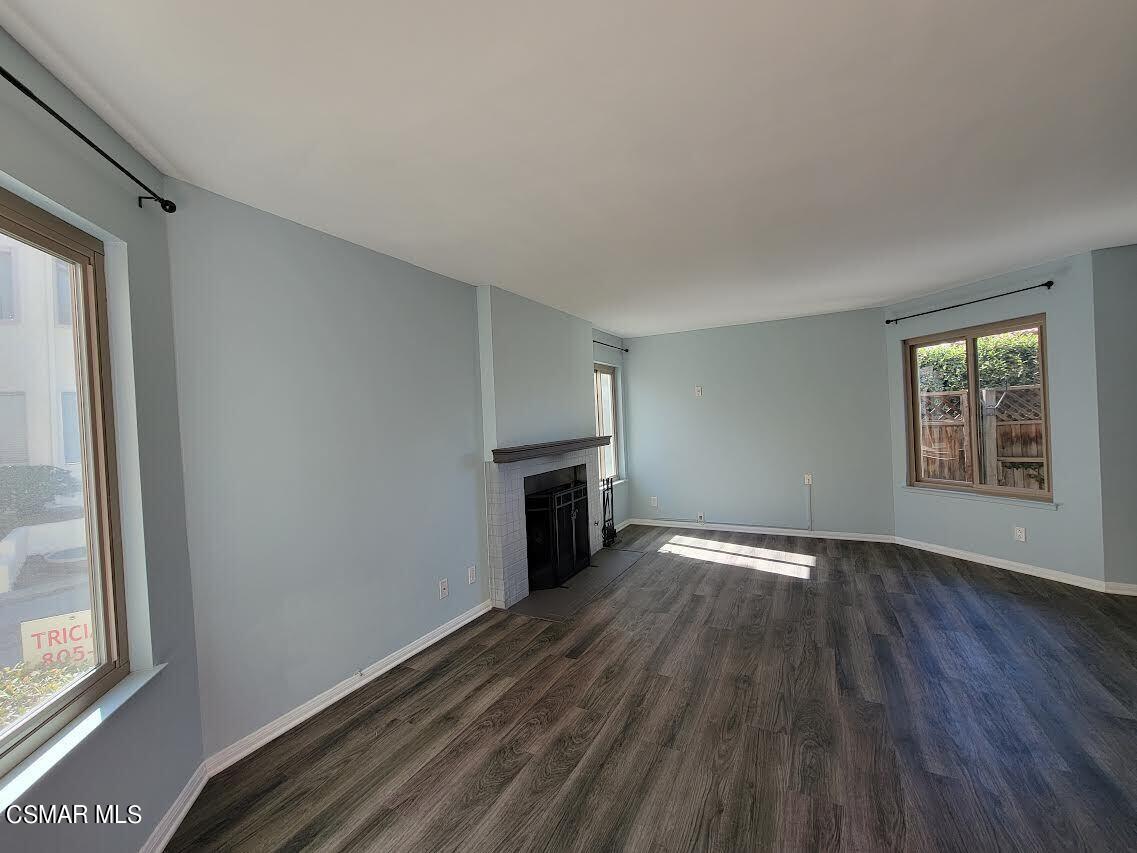 1724 Sinaloa Road, Unit 127 Simi Valley, CA 93065 - Photo 3 of 35 a view of an empty room with a window and wooden floor