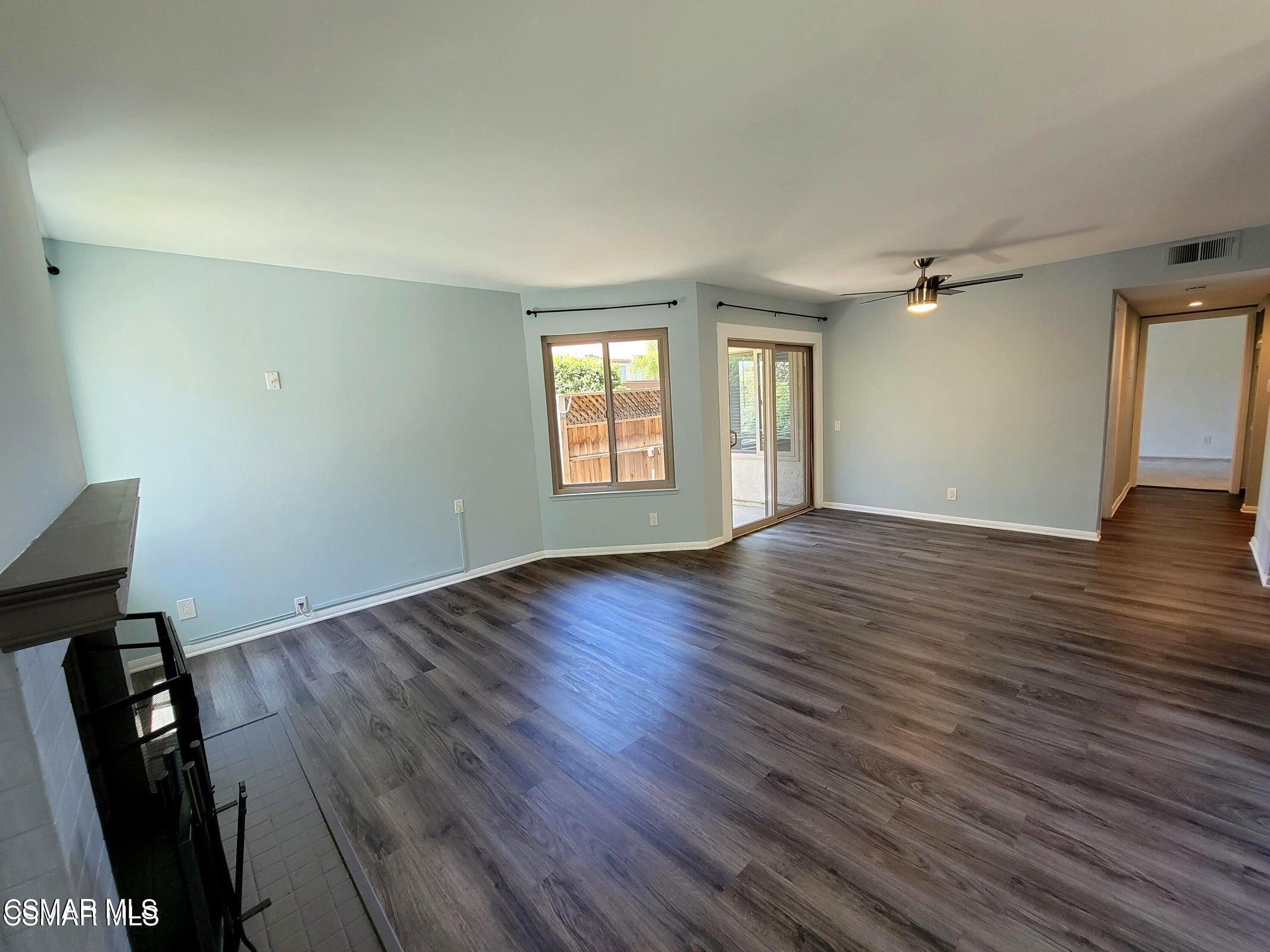 1724 Sinaloa Road, Unit 127 Simi Valley, CA 93065 - Photo 4 of 35 an empty room with wooden floor and windows