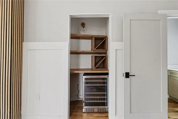 a view of closet with wooden floor