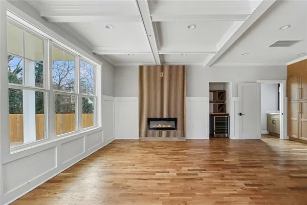 a view of a livingroom with an empty space and a window