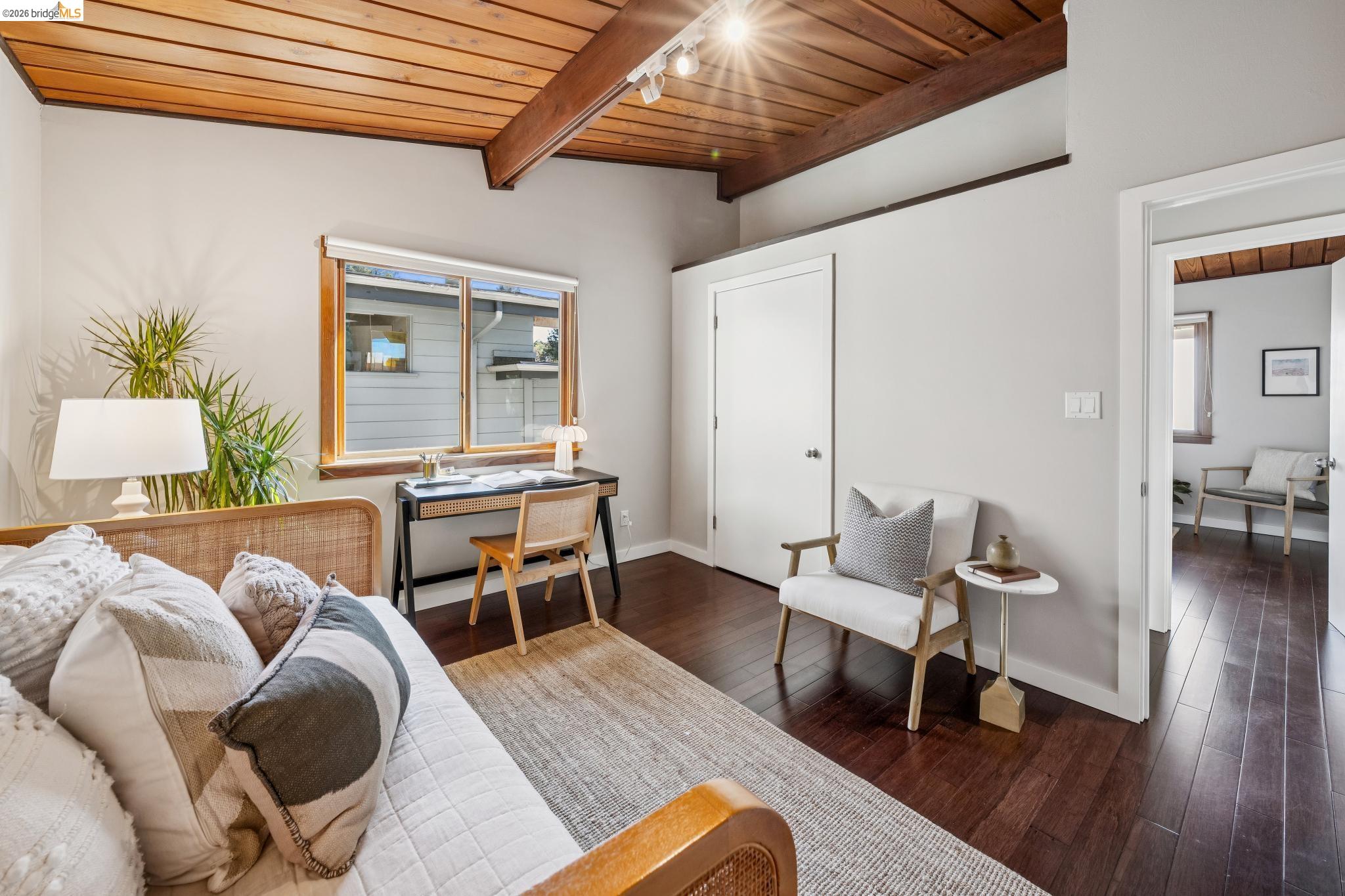 1394 Queens Road Berkeley, CA 94708 - Photo 30 of 63 Vaulted wood-paneled ceiling with exposed beams, wood-finish flooring, and a large window with wood trim