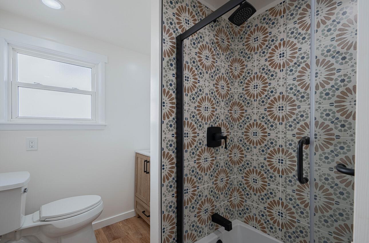 518 Cortes Street Monterey, CA 93940 - Photo 13 of 32 a bathroom with a toilet and a shower
