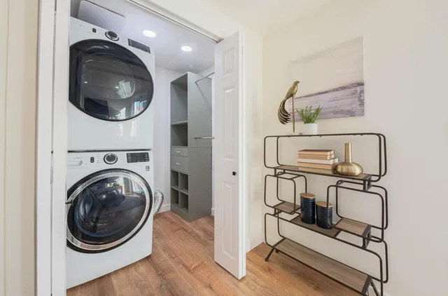 a view of a hallway with washer and dryer
