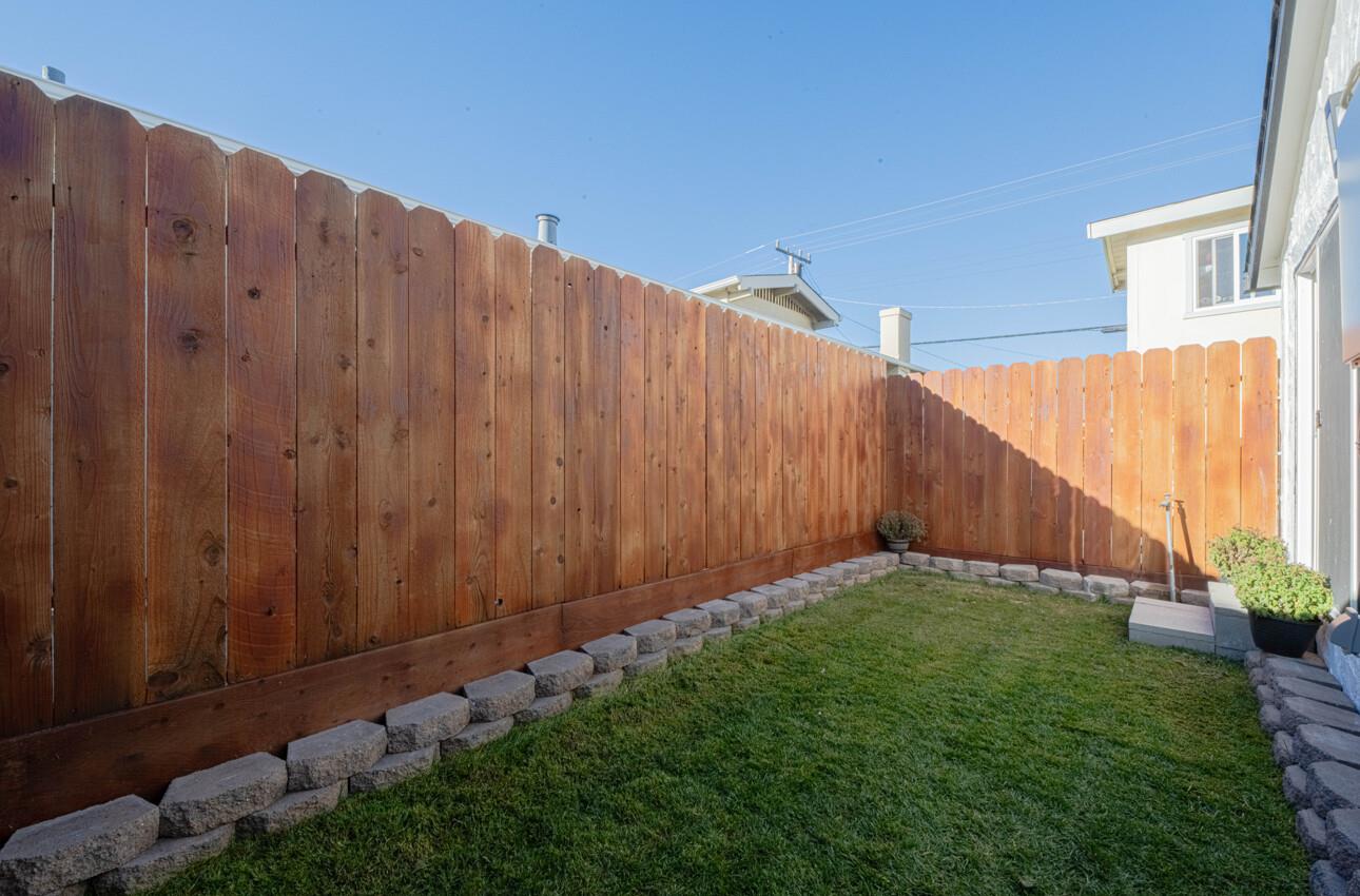 518 Cortes Street Monterey, CA 93940 - Photo 20 of 32 a view of a backyard with wooden fence