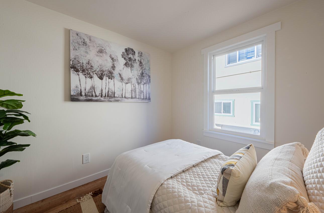 518 Cortes Street Monterey, CA 93940 - Photo 23 of 32 a bedroom with a bed and a window