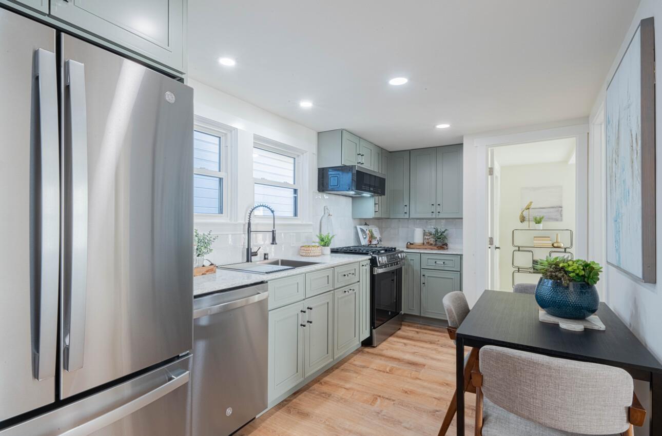 518 Cortes Street Monterey, CA 93940 - Photo 6 of 32 a kitchen with a sink stainless steel appliances and cabinets