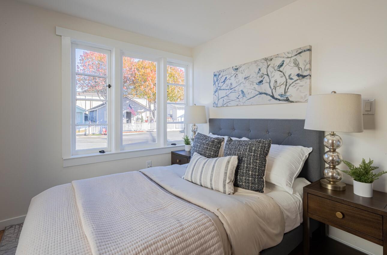 518 Cortes Street Monterey, CA 93940 - Photo 10 of 32 a large bed sitting in a bedroom next to a window